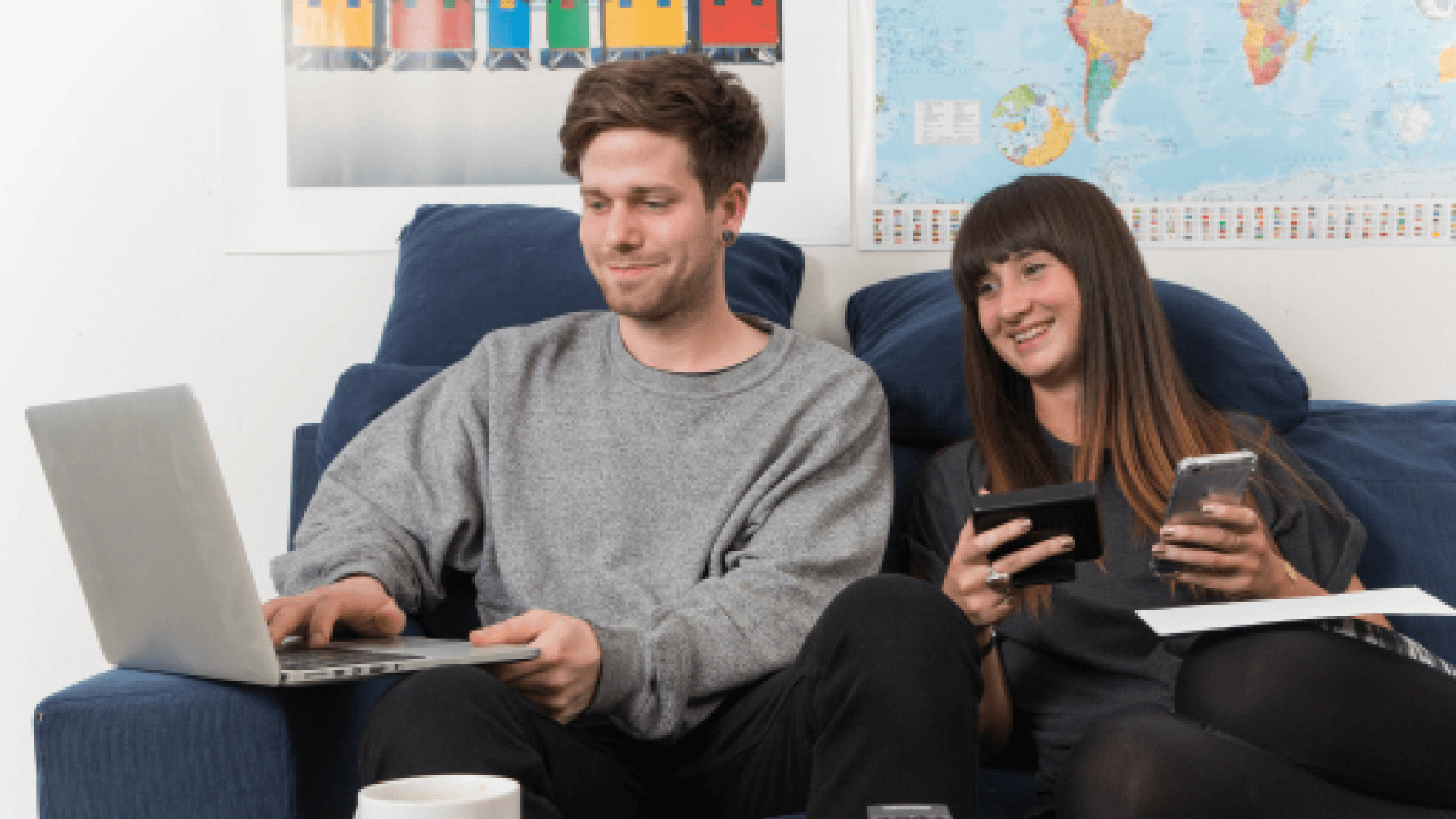 Couple reviewing energy bill with smart meter display in hand