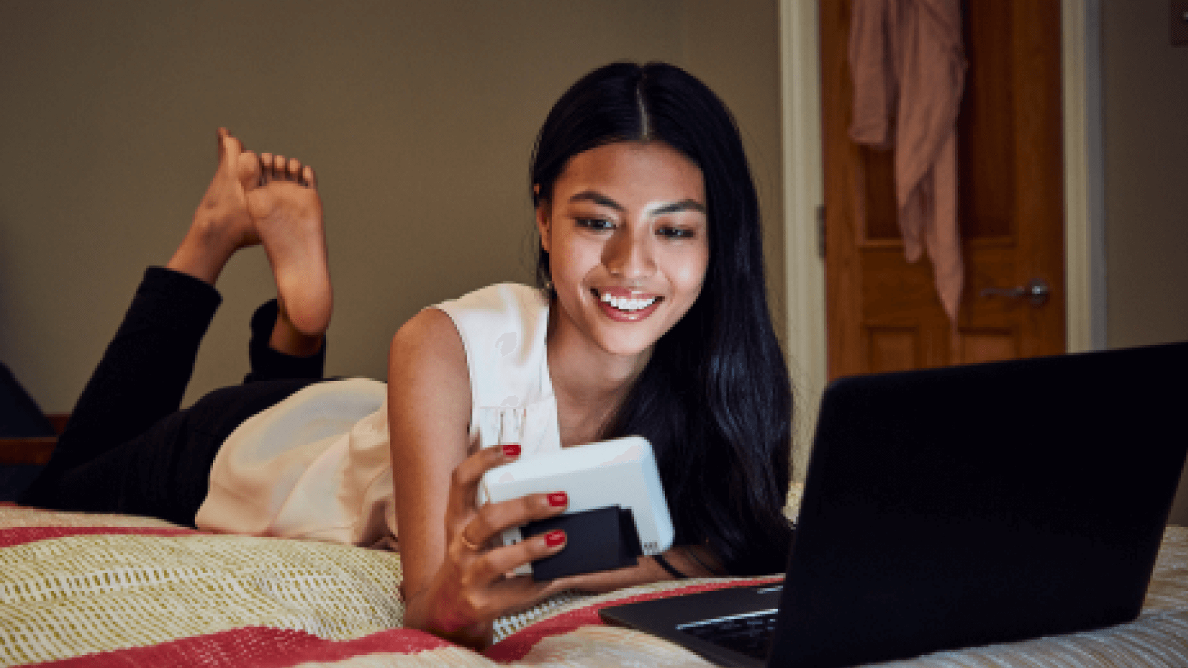 woman checking meter using electronic devices