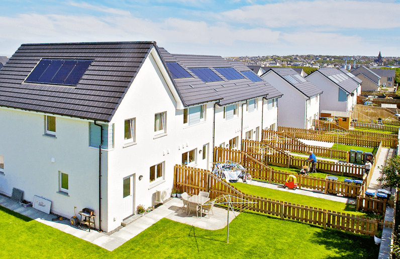 Arial view of houses with solar panels